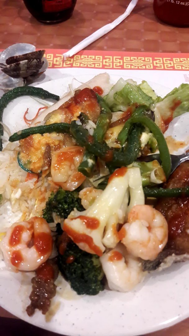 Self-service stations with sushi, salads, and hot dishes.
