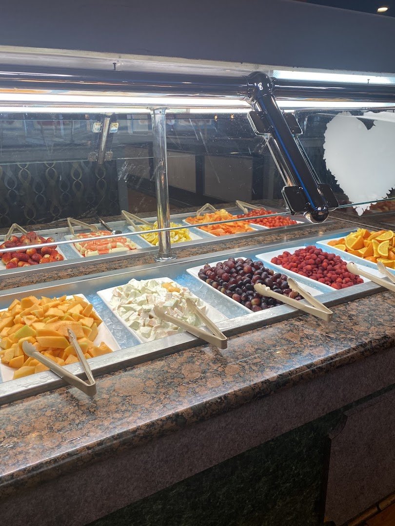 Self-service stations with sushi, salads, and hot dishes.